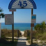 A public beach sign archway with the number 45